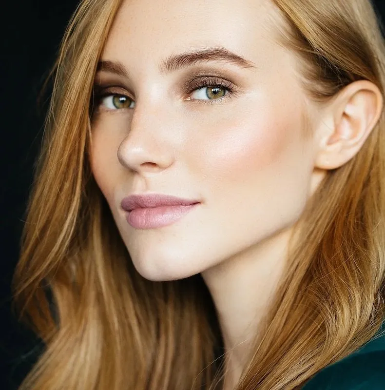 Woman with firm, smooth facial skin and defined jawline demonstrating non-surgical skin tightening results